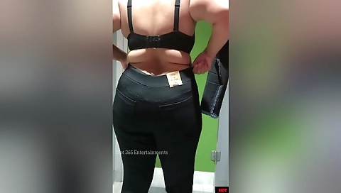 Changing Dress In A Public Trial Room At Clothing Store